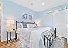 The second guest bedroom (downstairs) is equipped with a king bed and smart TV