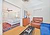 The bonus room off the primary suite offers seating and an office nook