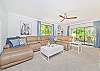 The living offers comfortable seating and smart TV