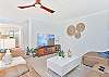The living offers comfortable seating and smart TV
