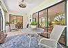 The spacious screened in patio offers a private view to the lush landscaping