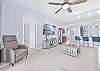 Reclining sofa end seats & chair and large smart TV in the living. 