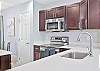 Fully equipped kitchen with breakfast bar