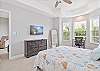 Primary suite with queen size bed, smart TV and office nook