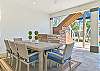 Outdoor covered dining area on the pool deck