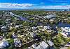 Dockside Dream is a stunning three story modern home on a canal with a private dock and Gulf Access, located 1.5 mile from Bonita and Barefoot Beach parking