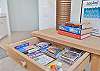 This unit is stocked with games and books to unwind after a busy day