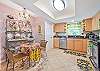 Fully equipped kitchen with breakfast nook and breakfast bar