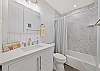 Primary bathroom with a shower tub combo