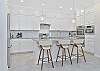 Fully equipped kitchen with island seating.