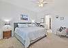 A king bed and smart TV and cable in the primary bedroom