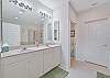 The en-suite primary bathroom features a soaking tub and shower and dual sinks