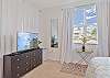 A king bed and smart TV and Direct TV in the primary bedroom