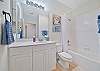 A shower-tub combo in the guest bathroom