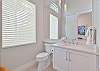 The front guest bath is also and en-suite to the fourth bedroom