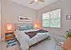 A king size bed in the second bedroom