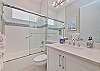 The guest bathroom is located in between the guest bedroom and third bedroom