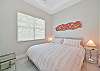 A king size bed in the fourth bedroom