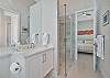 The front guest bath is also and en-suite to the fourth bedroom