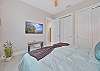 A king size bed in the second bedroom