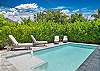 Private heated pool with lounge chairs to soak up the sun
