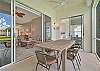 Oversized lanai with dining and seating areas and stunning lake view