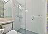 A spacious shower in the third bathroom