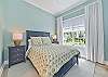 A Queen bed and smart TV with streaming only in the guest bedroom
