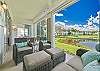 Oversized lanai with dining and seating areas and stunning lake view