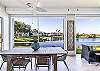 Enjoy the lake view from the oversized screened in lanai