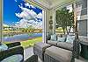Oversized lanai with dining and seating areas and stunning lake view