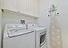The laundry room with sink, washer and dryer
