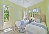 Two twin beds in the third bedroom