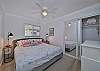 Primary bedroom with king size bed and smart TV