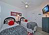 Two twin beds and smart TV in the third bedroom