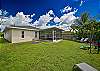 Large screened and covered lanai with spacious backyard