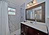 A spacious walk-in shower in teh en-suit eprimary bathroom