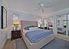 A king bed and smart TV in the guest bedroom