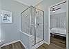 A shower in the primary bathroom