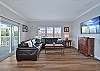 Comfortable seating and smart TV in the living. Sliding door to the large porch with bay view.