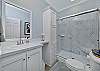 A spacious shower in the guest bathroom