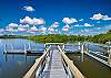 Enjoy amazing sunsets over the bay from the large porch or dock (right side, the walkway to the dock is shared with neighbor). 
