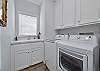 Laundry room with a sink, washer and dryer