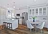 Fully equipped kitchen with island and dining area