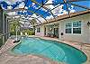 Private heated pool and spa, two lounge chairs and a covered seating area with TV