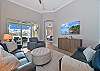 Living room with sliding doors opening up to the pool area