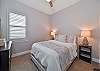 A queen bed in the guest bedroom