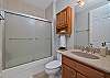 A shower-tub combo in the third bathroom