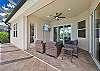 Covered seating area with TV, overlooking the private heated pool and spa with gorgeous lake view. 
A Blackstone grill