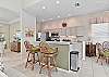Fully equipped kitchen with breakfast bar and breakfast nook with lake view